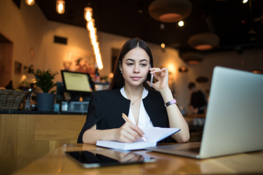 Government Woman in coffee shop taking a call