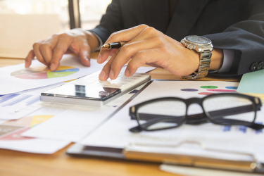 Businessman accountant doing manual tasks