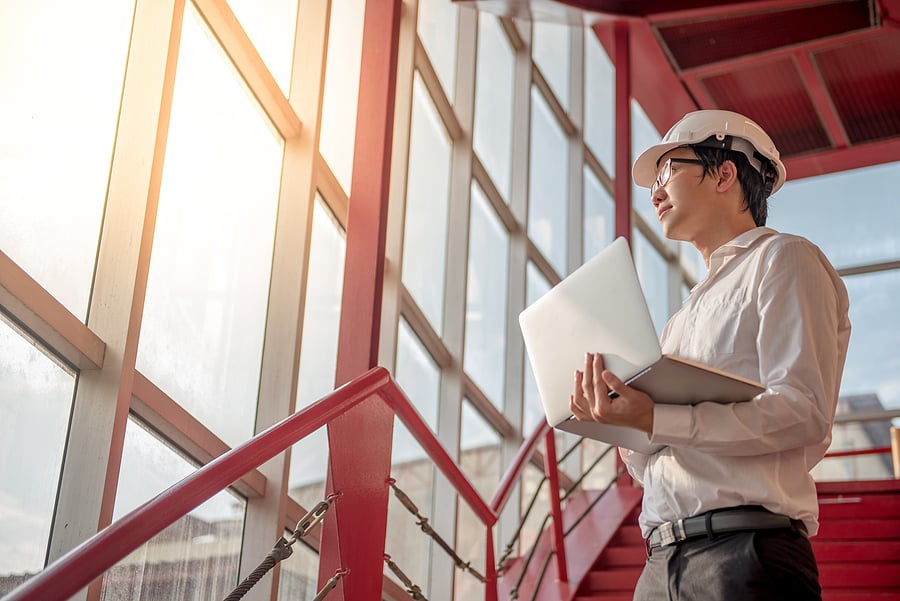 Young architect with laptop