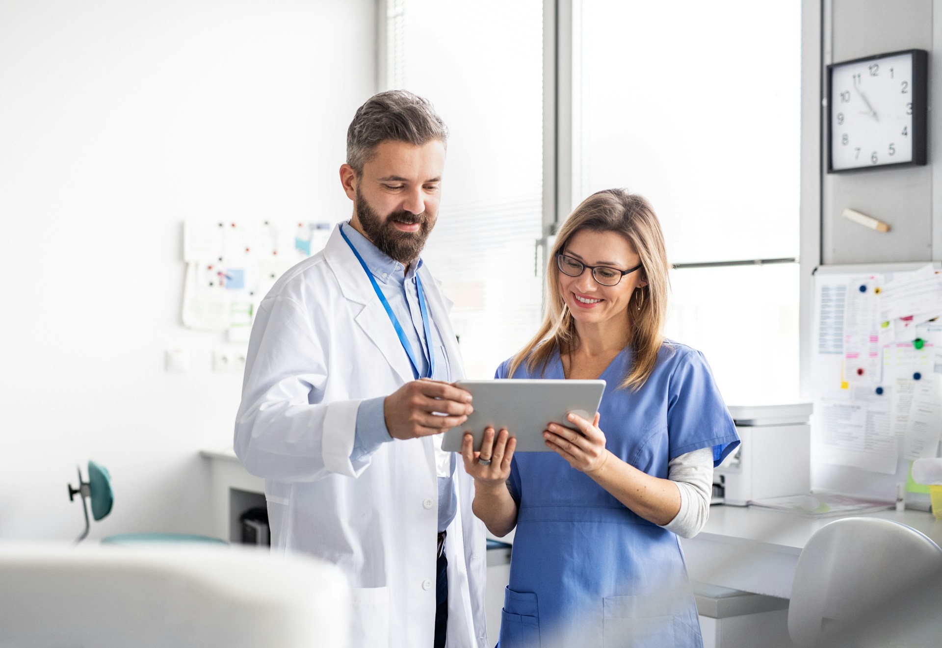 Healthcare workers browsing content on tablet 