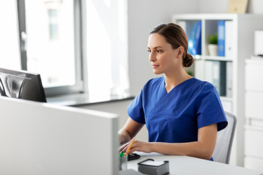 Medicine nurse on a computer
