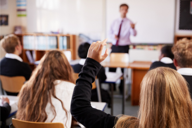 Students raising hands